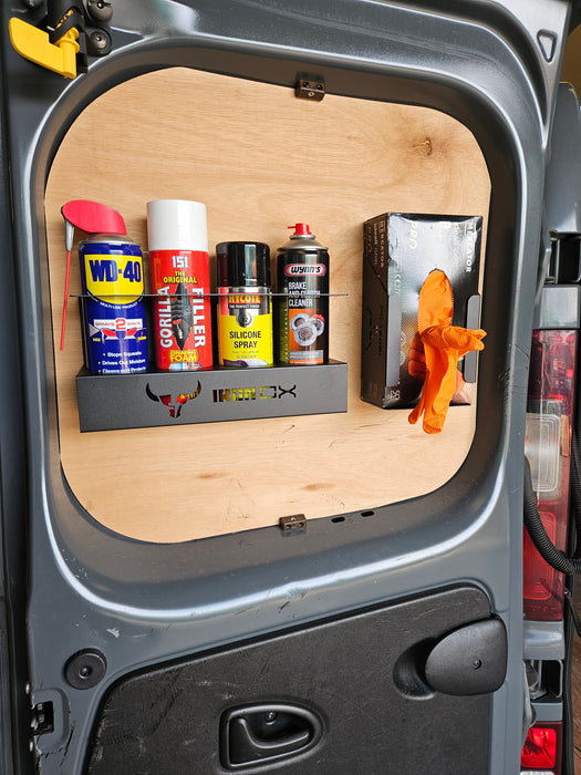 The interior of a vehicle door features a wall-mounted, space-saving Aerosol Can Holder with a small shelf holding various aerosol cans and a box of disposable gloves attached to the wooden panel.