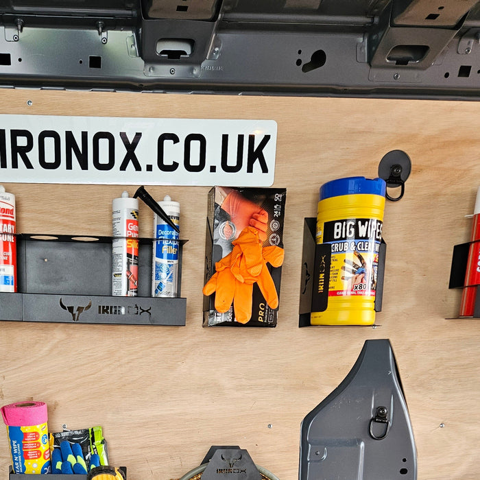 Organized workbench with shelves holding adhesives, gloves, and other tools; a sleek design adds to its appeal, featuring a universal fit for various items. A sign with "IRONOX.CO.UK" is displayed above, complemented by a big Wipe Dispenser Holder for easy access.