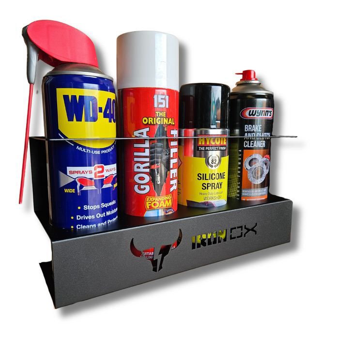 A wall-mounted Aerosol Can Holder holding five spray cans: WD-40, Gorilla Filler, Rocol Silicone Spray, Wynn's Brake and Clutch Cleaner, and a fifth can with a red nozzle. The Aerosol Can Holder has "Iron Ox" branding, perfect for van & workshop storage.